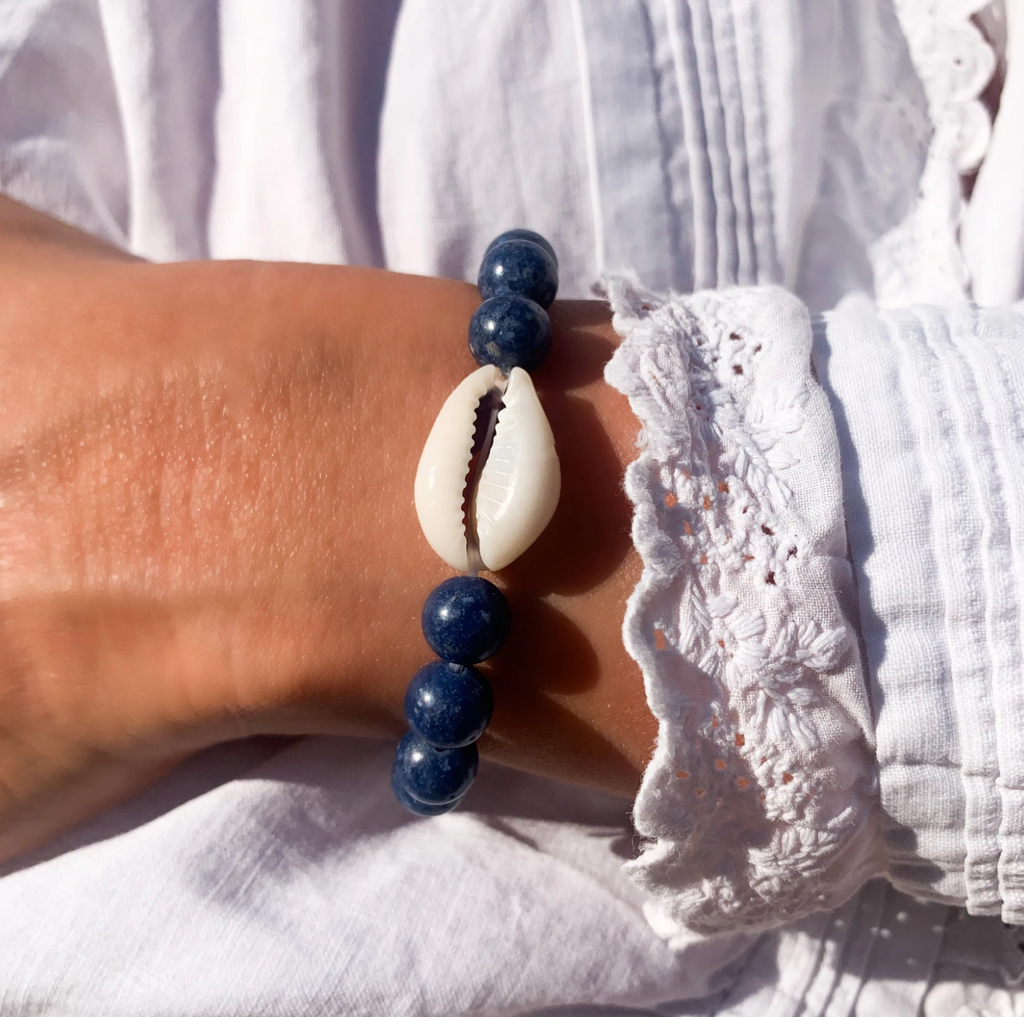 blue lapis 8mm beaded elastic bracelet with single natural cowrie shell