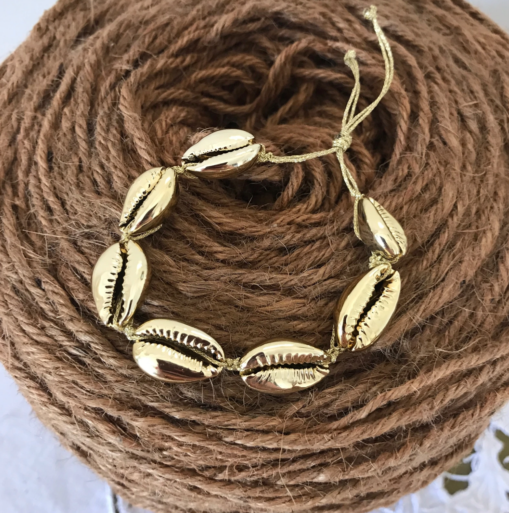 gold cowries on gold thread bracelet